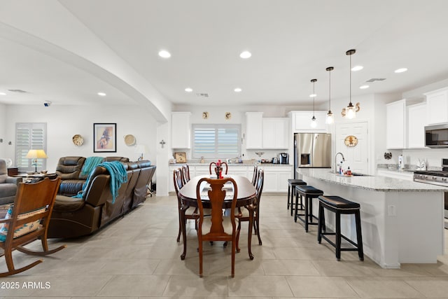 3655 N Astoria Dr, Florence, AZ 85132 - dining area with recessed lighting, light tile patterned flooring, and arched walkways