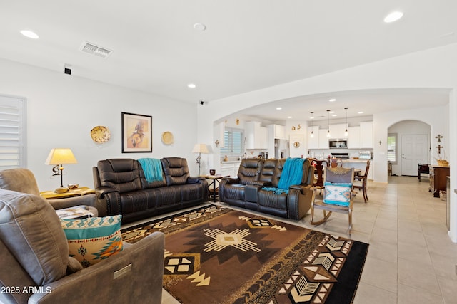 3655 N Astoria Dr, Florence, AZ 85132 - living room featuring arched walkways, light tile patterned flooring, and recessed lighting