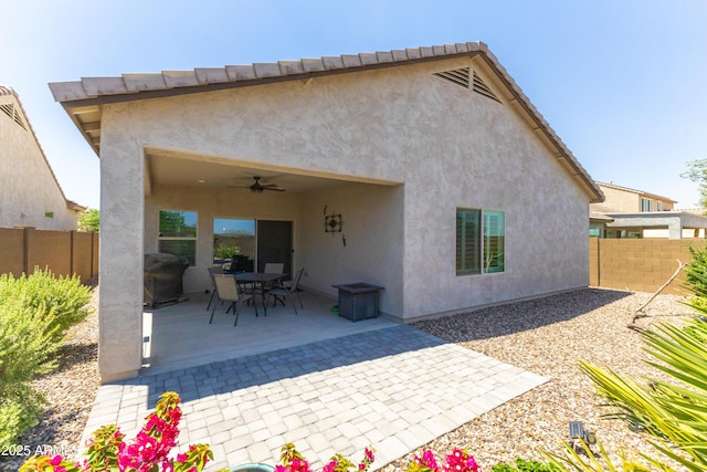 3655 N Astoria Dr, Florence, AZ 85132 - back of house featuring a ceiling fan, stucco siding, a fenced backyard, and a patio area