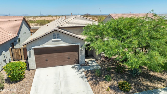 3655 N Astoria Dr, Florence, AZ 85132 - view of front of home with driveway, an attached garage, stucco siding, and a tile roof