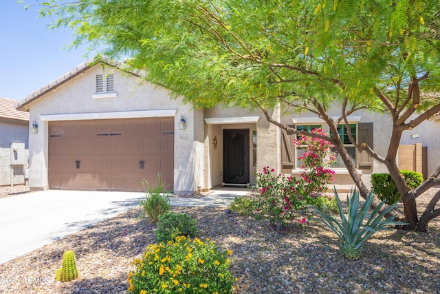 3655 N Astoria Dr, Florence, AZ 85132 - view of front of property featuring stucco siding, a garage, and driveway