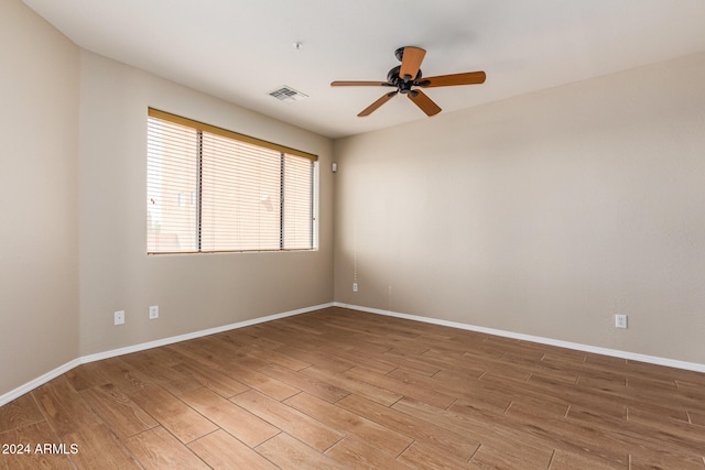 unfurnished room featuring hardwood / wood-style floors and ceiling fan