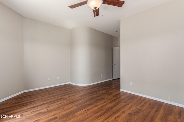 spare room featuring dark hardwood / wood-style floors and ceiling fan