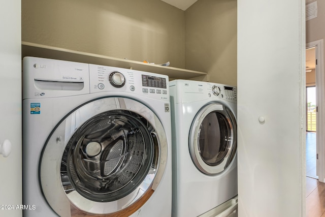 washroom with separate washer and dryer