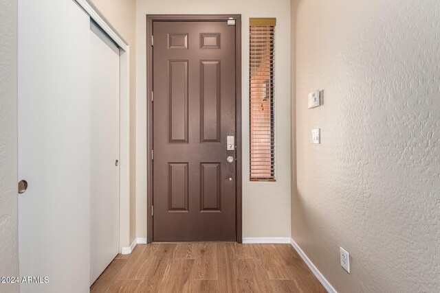 doorway to outside with light hardwood / wood-style flooring