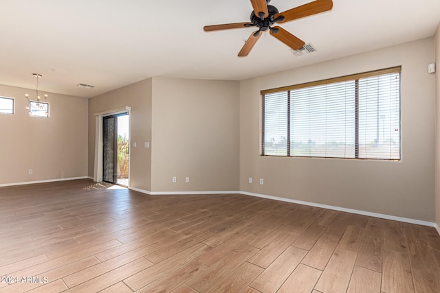 spare room with light hardwood / wood-style floors and ceiling fan