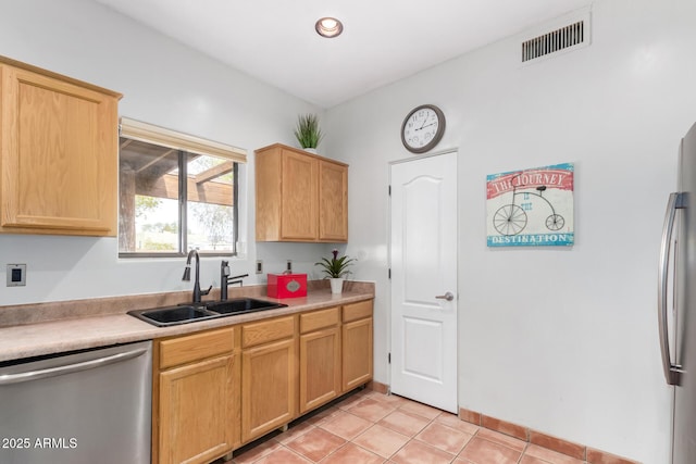 1730 W Adamanda Ct, Phoenix, AZ 85086 - kitchen featuring stainless steel appliances, a sink, light tile patterned flooring, and light countertops