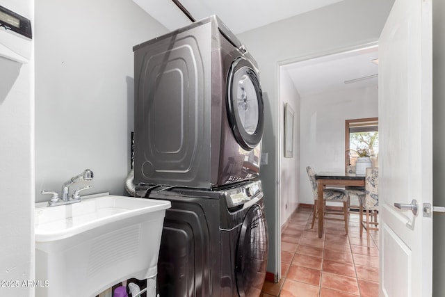 1730 W Adamanda Ct, Phoenix, AZ 85086 - clothes washing area with stacked washer and clothes dryer and light tile patterned floors