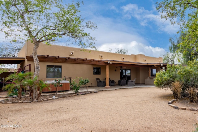 1730 W Adamanda Ct, Phoenix, AZ 85086 - back of property featuring a patio, stucco siding, and a ceiling fan