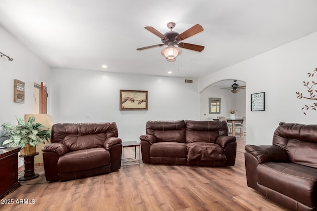 1730 W Adamanda Ct, Phoenix, AZ 85086 - living room featuring a ceiling fan, wood finished floors, recessed lighting, and arched walkways