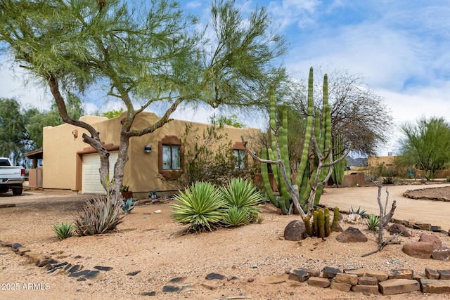 1730 W Adamanda Ct, Phoenix, AZ 85086 - view of front facade featuring an attached garage, driveway, and stucco siding