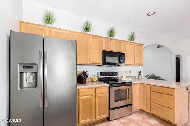 1730 W Adamanda Ct, Phoenix, AZ 85086 - kitchen with appliances with stainless steel finishes, a peninsula, arched walkways, light countertops, and recessed lighting