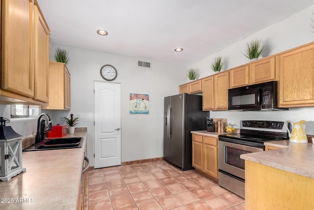 1730 W Adamanda Ct, Phoenix, AZ 85086 - kitchen featuring stainless steel appliances, a sink, light countertops, recessed lighting, and light tile patterned flooring