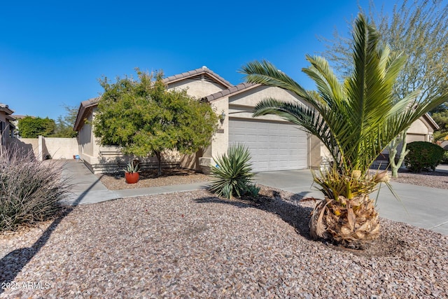 obstructed view of property with a garage