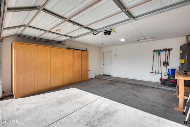 garage featuring a garage door opener and gas water heater