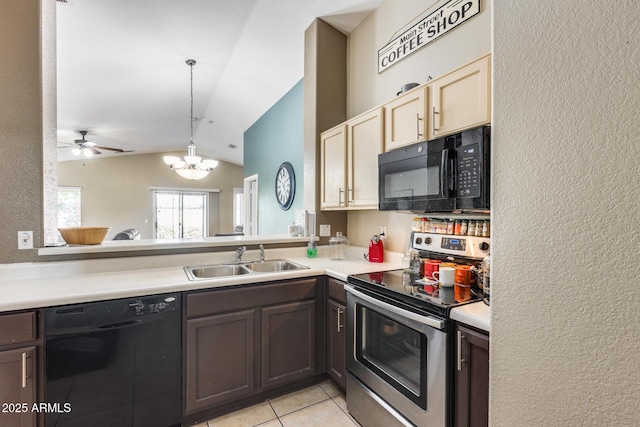 kitchen with vaulted ceiling, sink, dark brown cabinetry, black appliances, and cream cabinetry