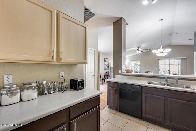 kitchen with vaulted ceiling, black dishwasher, sink, light tile patterned floors, and cream cabinetry