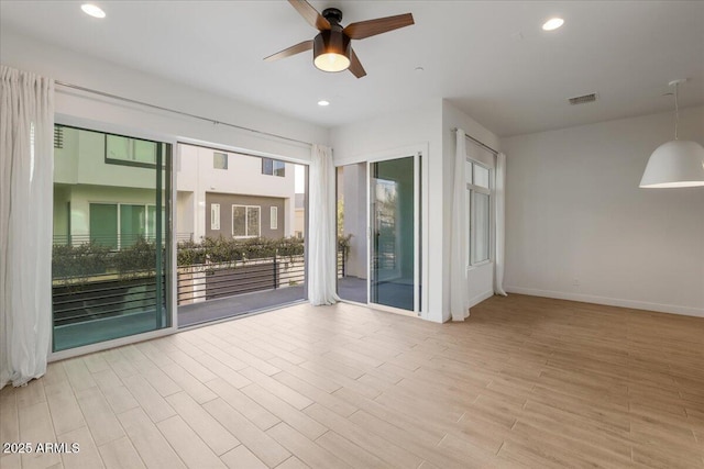 1717 E Morten Ave Unit 2, Phoenix, AZ 85020 - spare room with ceiling fan and light hardwood / wood-style floors