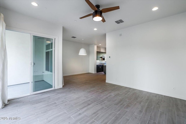 1717 E Morten Ave Unit 2, Phoenix, AZ 85020 - empty room with hardwood / wood-style floors and ceiling fan