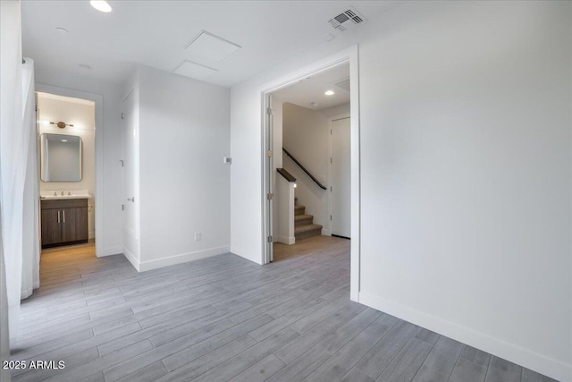1717 E Morten Ave Unit 2, Phoenix, AZ 85020 - unfurnished room with sink and light hardwood / wood-style floors
