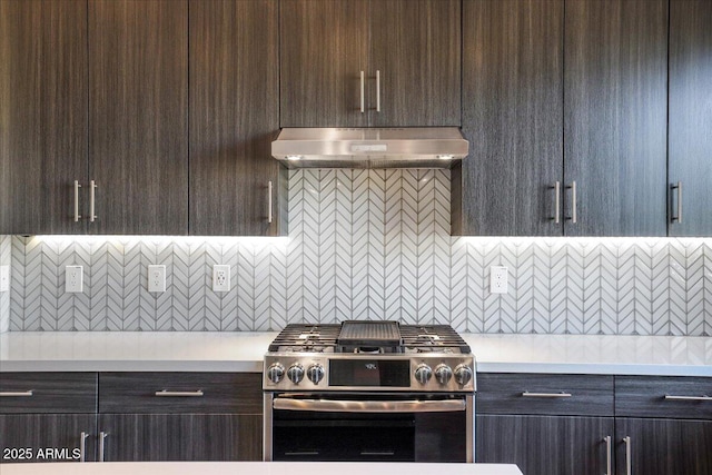 1717 E Morten Ave Unit 2, Phoenix, AZ 85020 - kitchen with tasteful backsplash, dark brown cabinetry, exhaust hood, and stainless steel range with gas cooktop