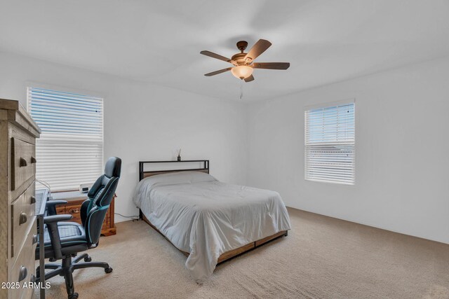 6754 E Via Rancho Rosario, Tucson, AZ 85756 - bedroom featuring light carpet, a desk, and ceiling fan