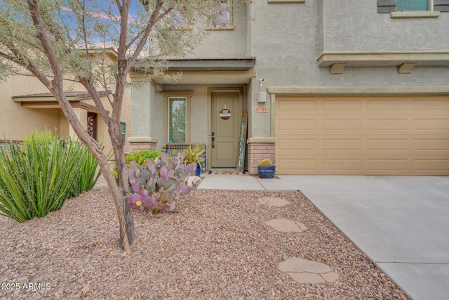 6754 E Via Rancho Rosario, Tucson, AZ 85756 - view of front of home with stucco siding, a garage, and driveway