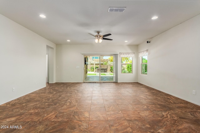 spare room with ceiling fan