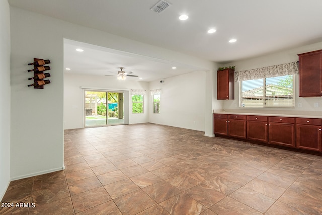 kitchen featuring ceiling fan and a healthy amount of sunlight