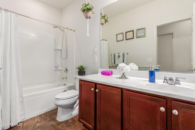 full bathroom with shower / bath combo, vanity, and toilet