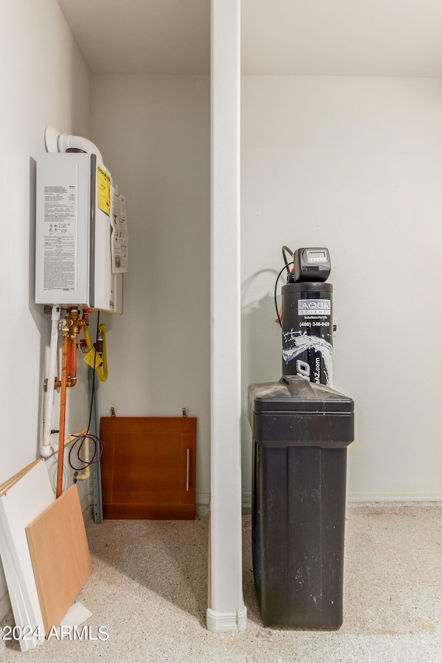 utility room with tankless water heater