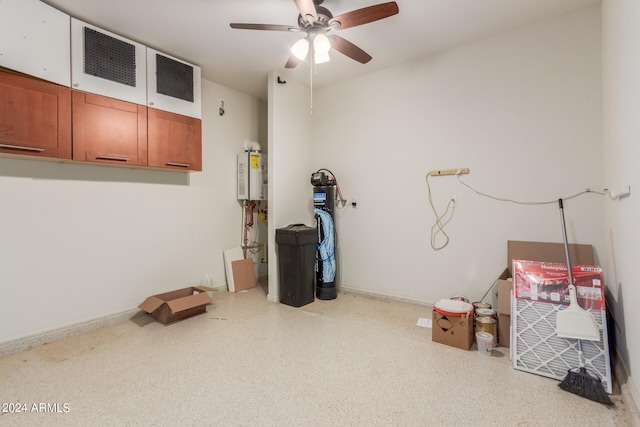 miscellaneous room with ceiling fan and tankless water heater