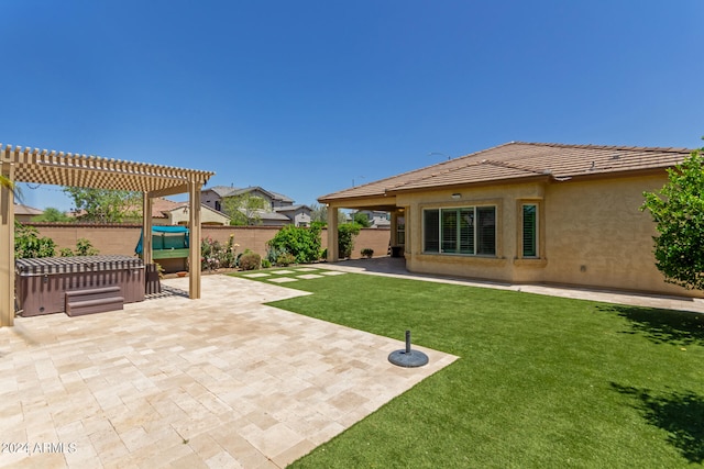 exterior space featuring a hot tub and a pergola