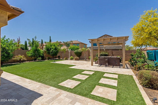 view of yard with a hot tub, a pergola, and a patio area