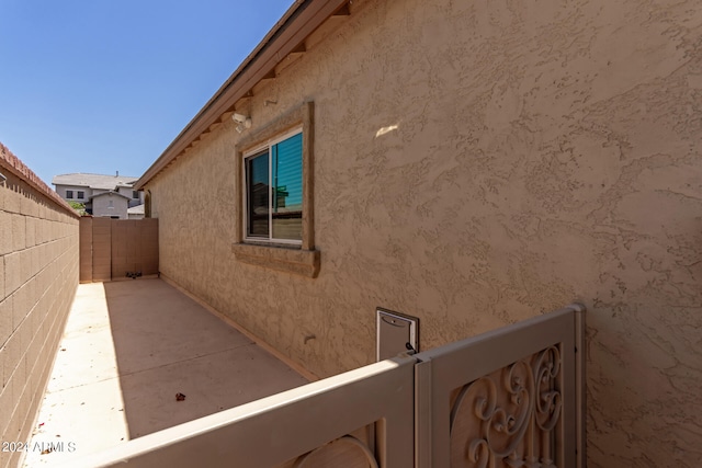 view of side of home featuring a patio area