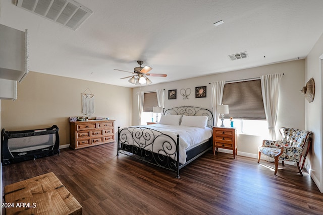 bedroom with ceiling fan and dark hardwood / wood-style floors