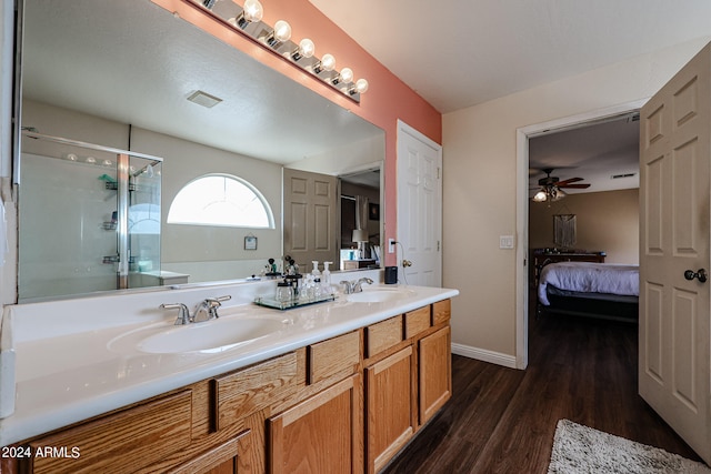 bathroom featuring vanity, hardwood / wood-style flooring, ceiling fan, and a shower with shower door