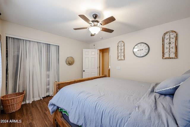 bedroom featuring dark wood-type flooring and ceiling fan