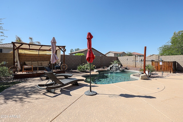 view of swimming pool featuring outdoor lounge area and pool water feature