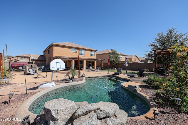 view of swimming pool with a patio area