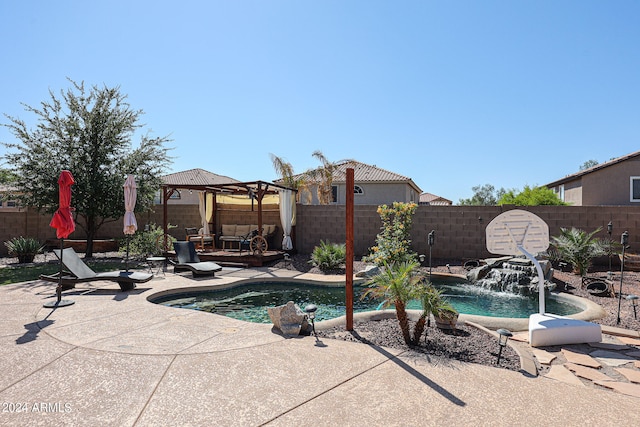 view of swimming pool featuring a patio, outdoor lounge area, a gazebo, and pool water feature