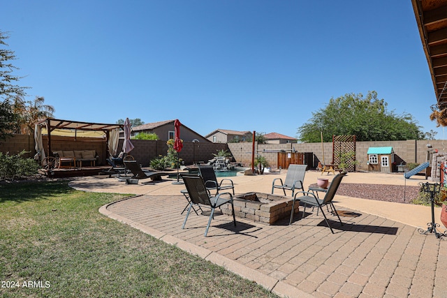 view of patio / terrace with an outdoor living space with a fire pit and a pergola