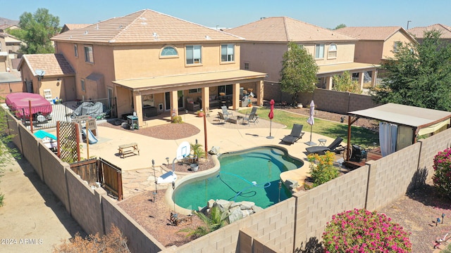 view of pool featuring a patio area