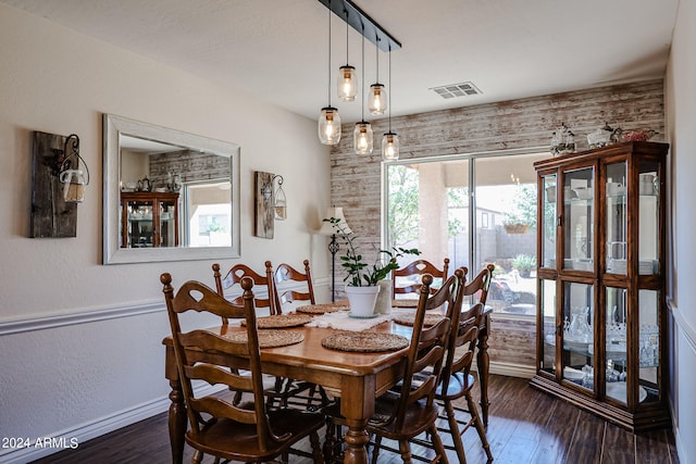 dining area featuring dark hardwood / wood-style flooring