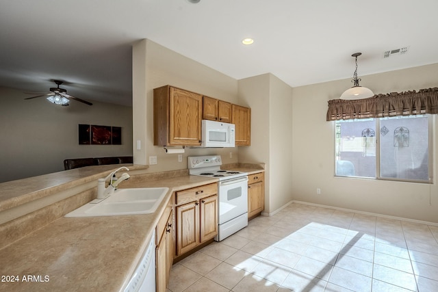 kitchen with light tile patterned flooring, sink, hanging light fixtures, ceiling fan, and white appliances