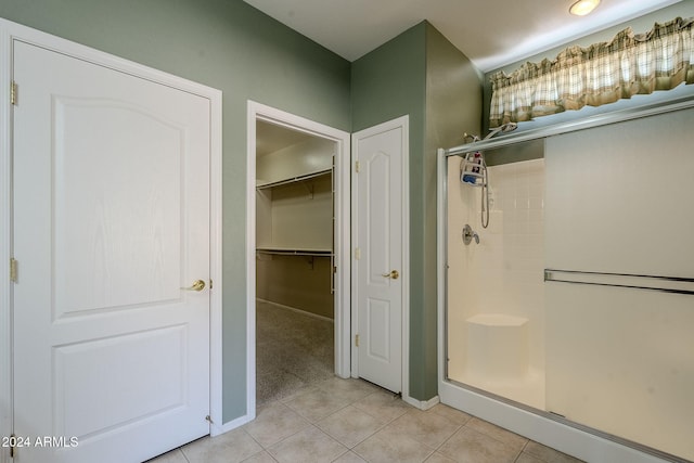 bathroom featuring tile patterned floors and walk in shower