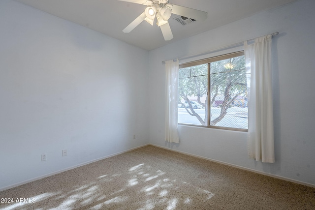 carpeted empty room with ceiling fan