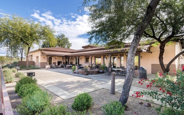 back of house with a patio area