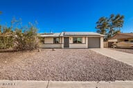 single story home featuring a garage