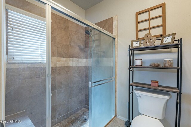 full bath with a shower stall and toilet